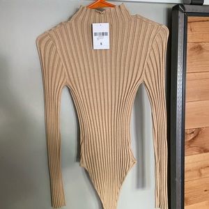 Tan ribbed turtleneck bodysuit